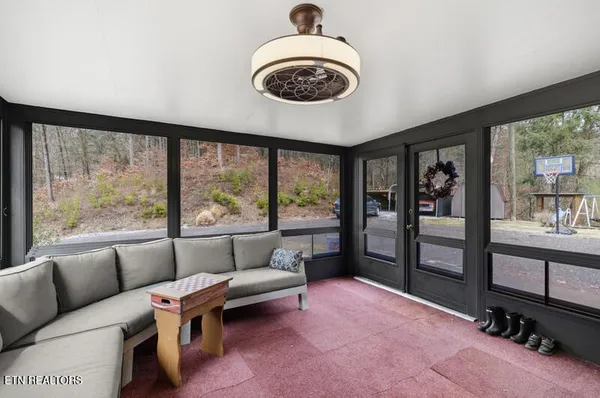 a living room with furniture and a flat screen tv