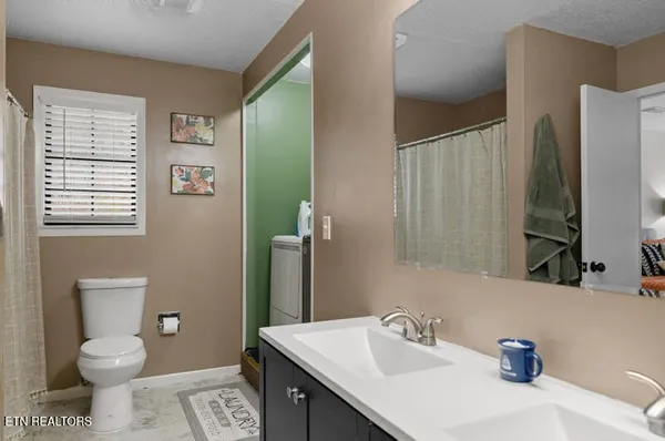 a view of storage and utility room with washer and dryer