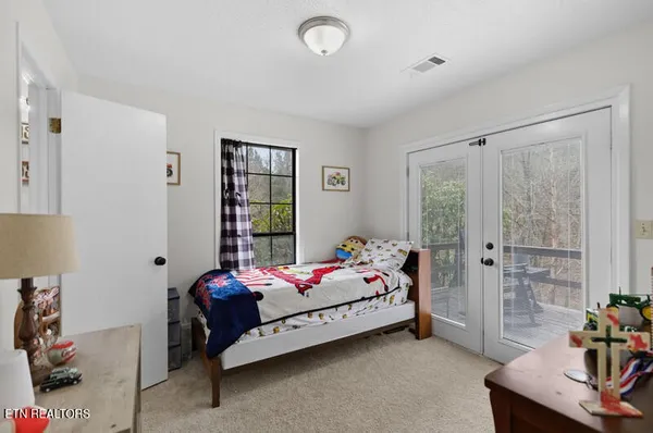 a bedroom with bed and closet