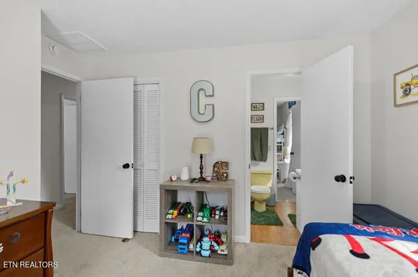 a bedroom with furniture and a window