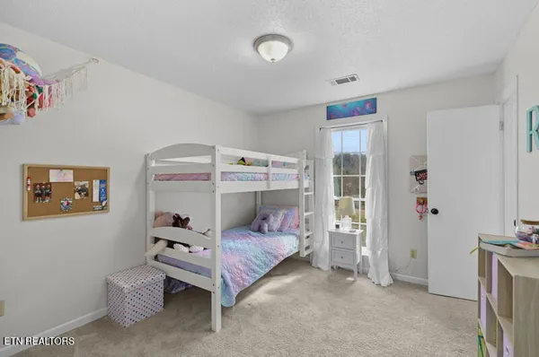 a room with furniture and white walls