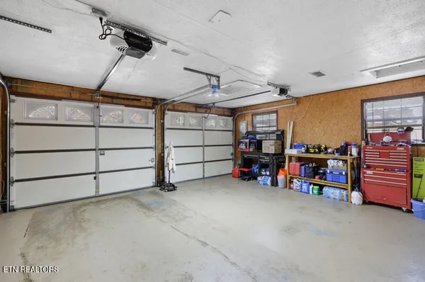 a view of a garage with rack and bicycle