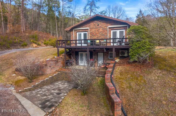 a house with trees in the background