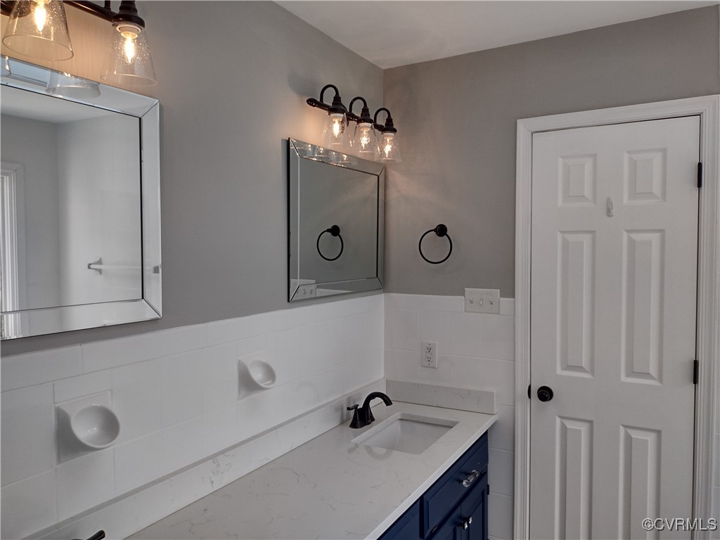 3249 Maidens Road Powhatan, VA 23139 - Photo 22 of 45 Bathroom with tile walls and vanity