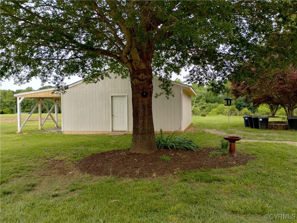 3249 Maidens Road Powhatan, VA 23139 - Photo 42 of 45 View of green lawn with an outbuilding