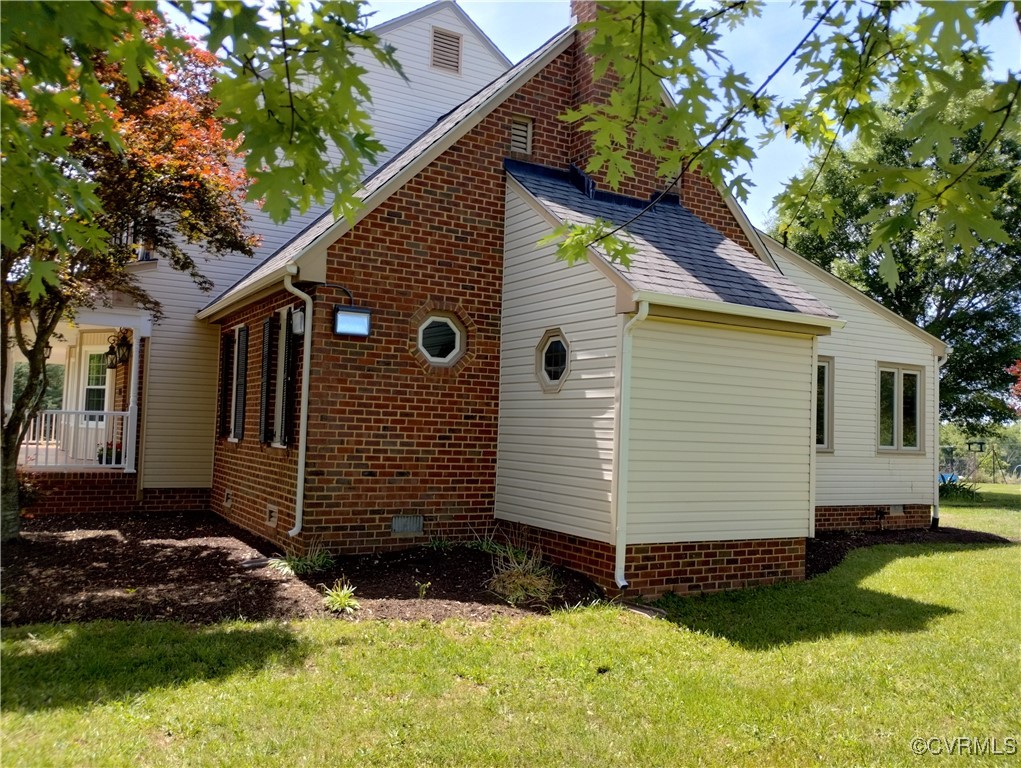 3249 Maidens Road Powhatan, VA 23139 - Photo 8 of 45 View of property exterior featuring a yard, crawl