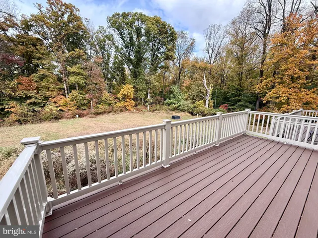 a view of deck with wooden floor and fence