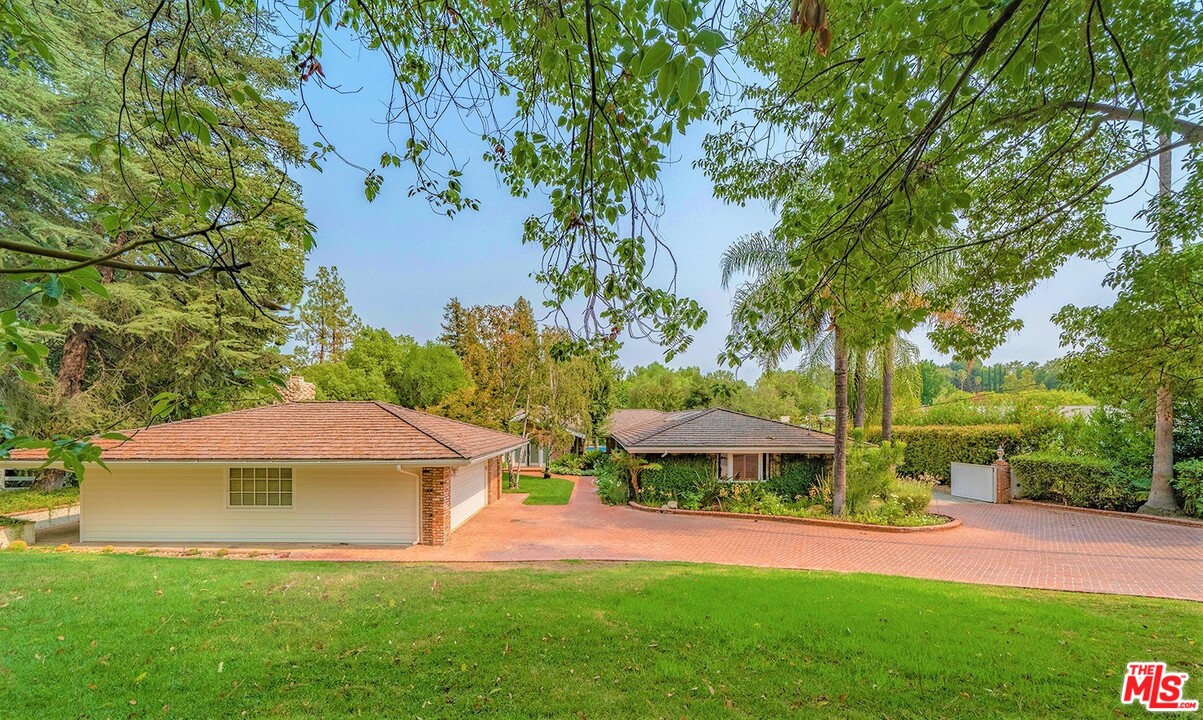5470 Hoback Glen Road Calabasas, CA 91302 - Photo 2 of 3 a view of a house with a yard and a large tree
