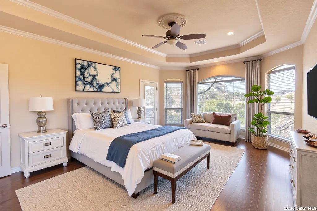 198 Echo Falls Road Comfort, TX 78013 - Photo 14 of 28 a spacious bedroom with a bed and a couch