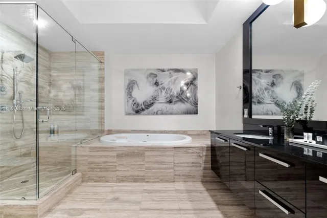 a view of a bathroom with a bathtub and a shower