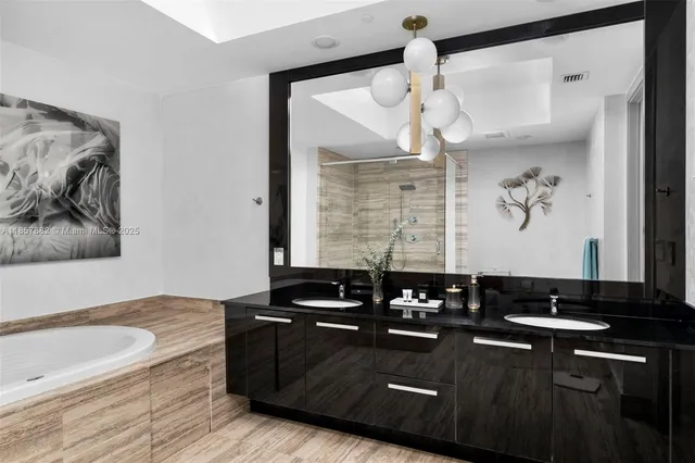 a bathroom with a bathtub and a sink