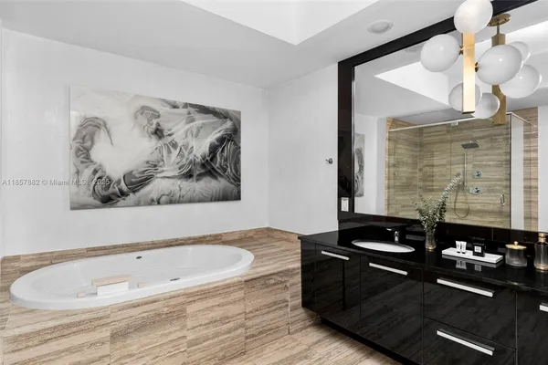 a room with a wooden floor and a large mirror