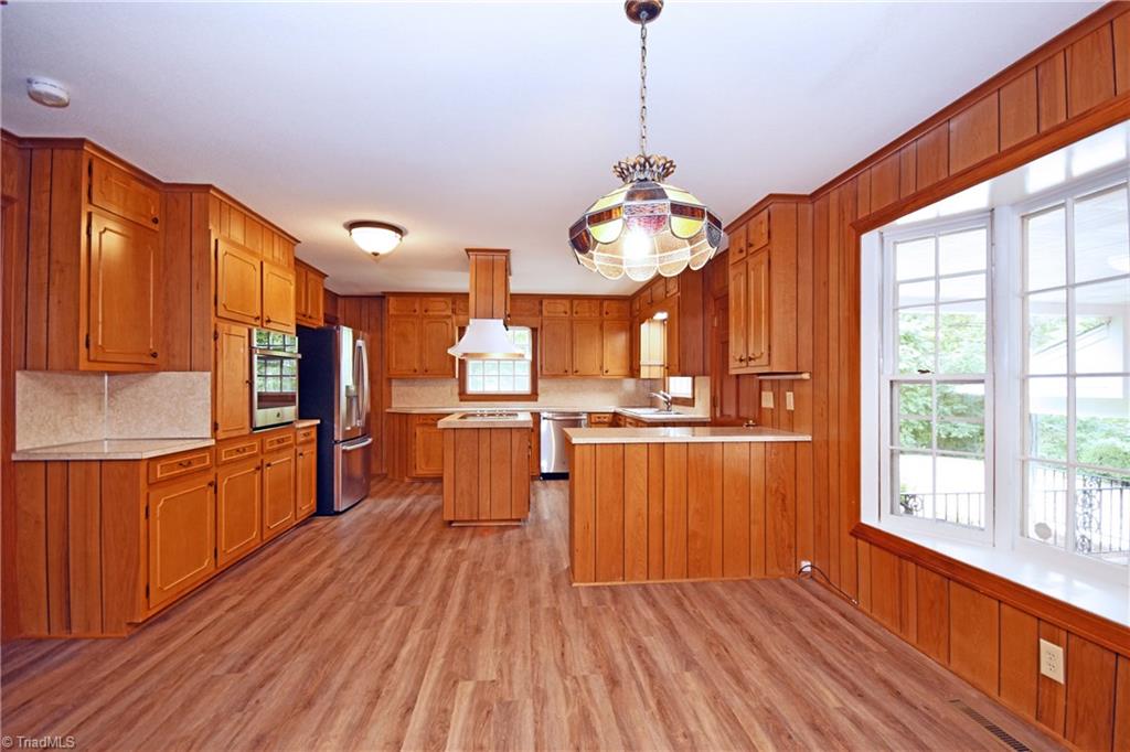 155 Tutterow Road Mocksville, NC 27028 - Photo 11 of 30 Open Kitchen with Bay Window Dining Area Looking out to back covered patio.