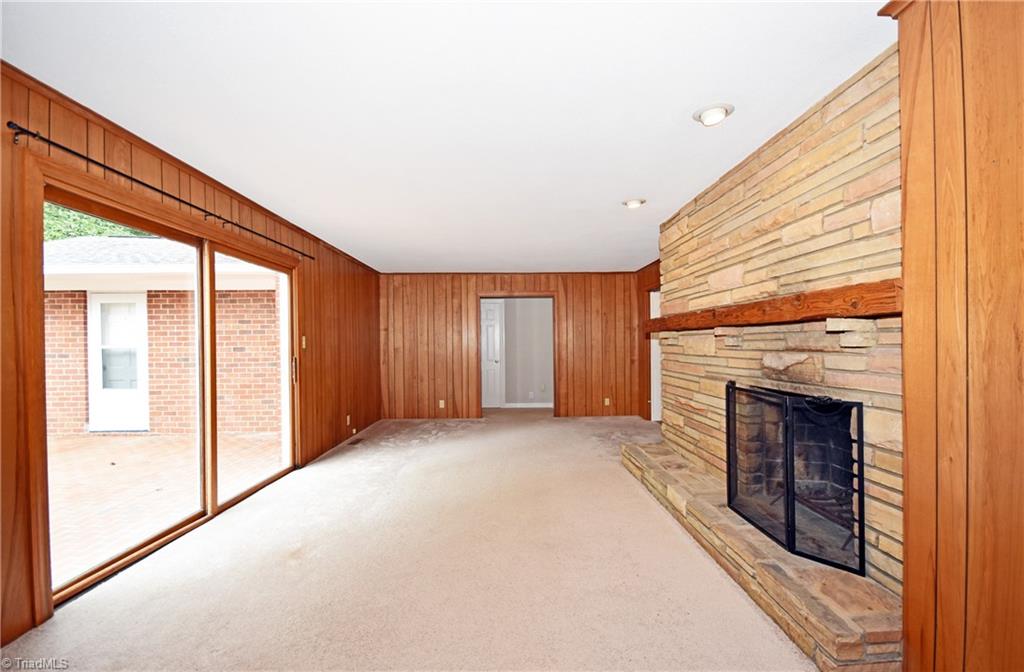 155 Tutterow Road Mocksville, NC 27028 - Photo 13 of 30 Den with fireplace and sliding doors to newly resurfaced back patio.