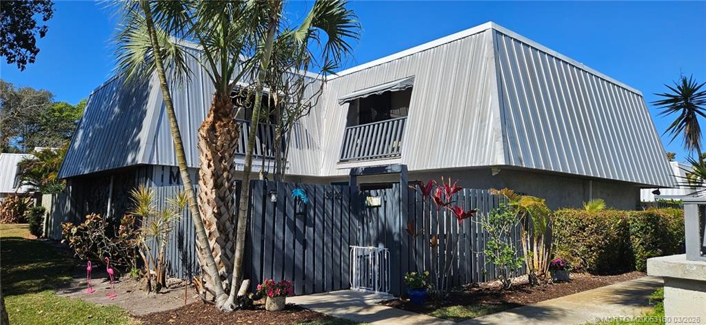 3828 Jefferson Street Stuart, FL 34997 - Photo 14 of 19 a front view of a house with parking
