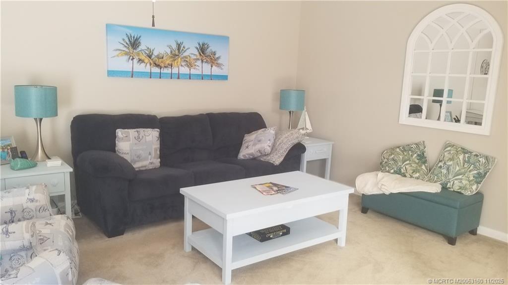3828 Jefferson Street Stuart, FL 34997 - Photo 3 of 15 a living room with furniture and a table