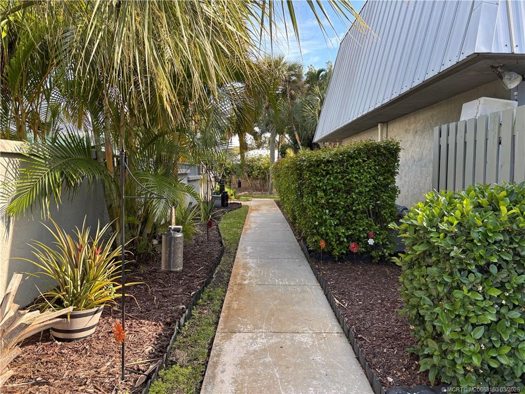 3828 Jefferson Street Stuart, FL 34997 - Photo 3 of 19 a view of a pathway with a plants