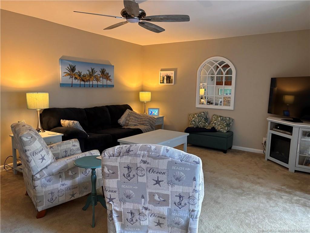 3828 Jefferson Street Stuart, FL 34997 - Photo 5 of 19 a living room with furniture and a flat screen tv