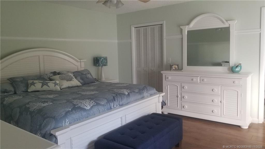 3828 Jefferson Street Stuart, FL 34997 - Photo 9 of 15 a bedroom with a bed and a dresser