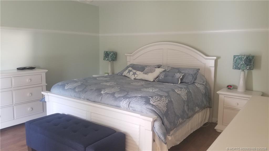 3828 Jefferson Street Stuart, FL 34997 - Photo 10 of 19 a bedroom with a bed and a cabinets