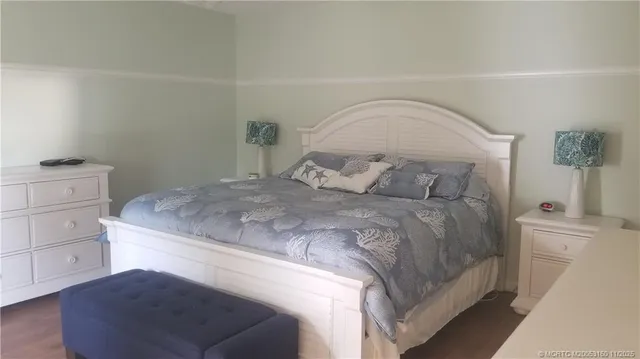 a bedroom with a bed and a cabinets