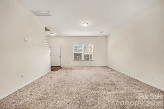 an empty room with a empty space and window