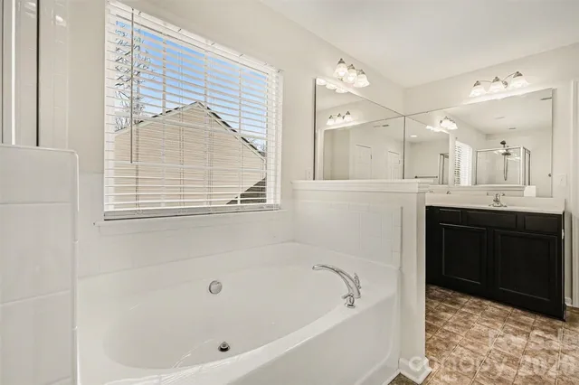 a bathroom with a bathtub and a sink