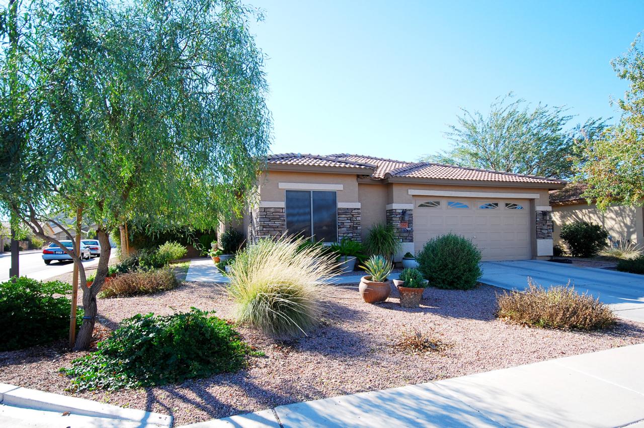 2043 West Tanner Ranch Road Queen Creek, AZ 85144 - Photo 1 of 18 a view of a house with a patio