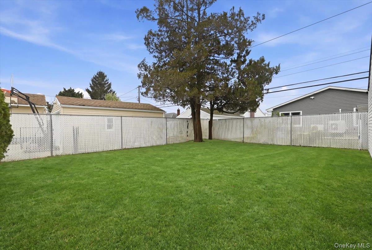 84 North Fordham Road Hicksville, NY 11801 - Photo 27 of 28 a view of a backyard with a garden