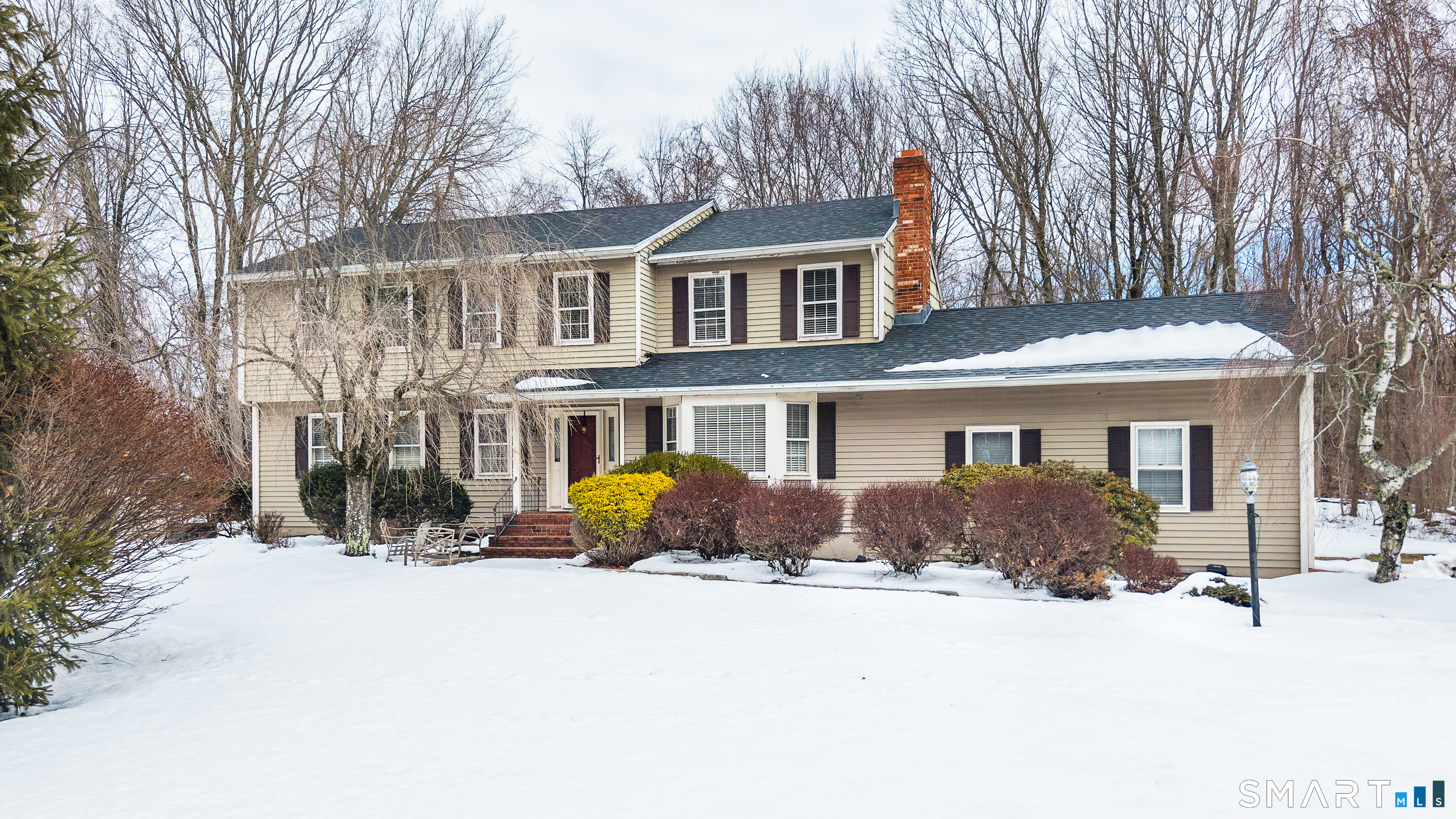 34 Bagburn Hill Road Monroe, CT 06468 - Photo 1 of 28 a front view of a house with a yard covered in snow