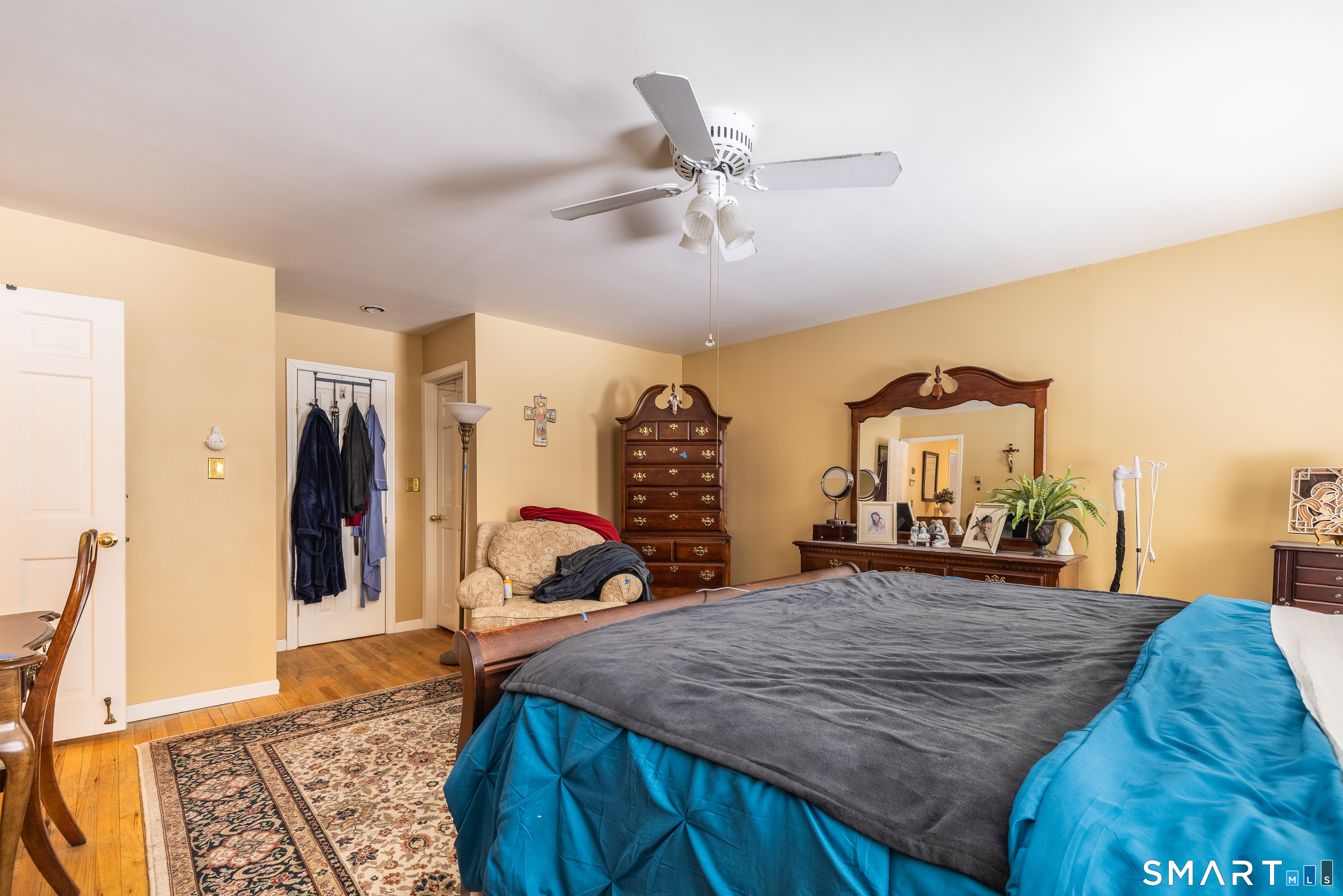 34 Bagburn Hill Road Monroe, CT 06468 - Photo 14 of 28 a bed room with a bed and a chandelier