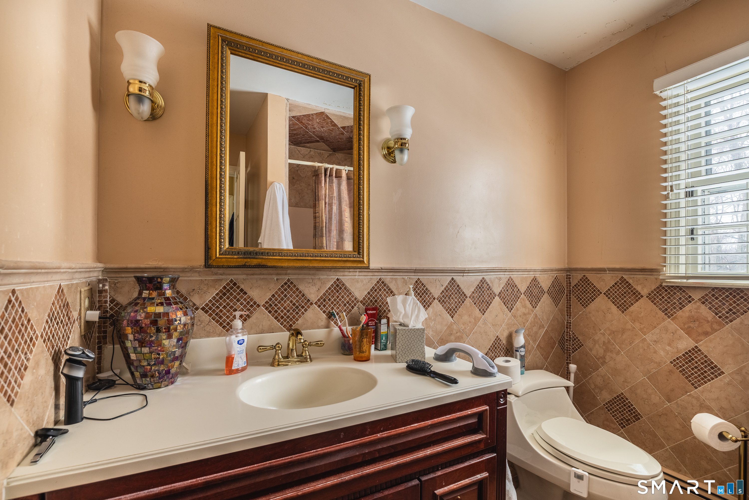 34 Bagburn Hill Road Monroe, CT 06468 - Photo 16 of 28 a bathroom with a granite countertop sink and a mirror