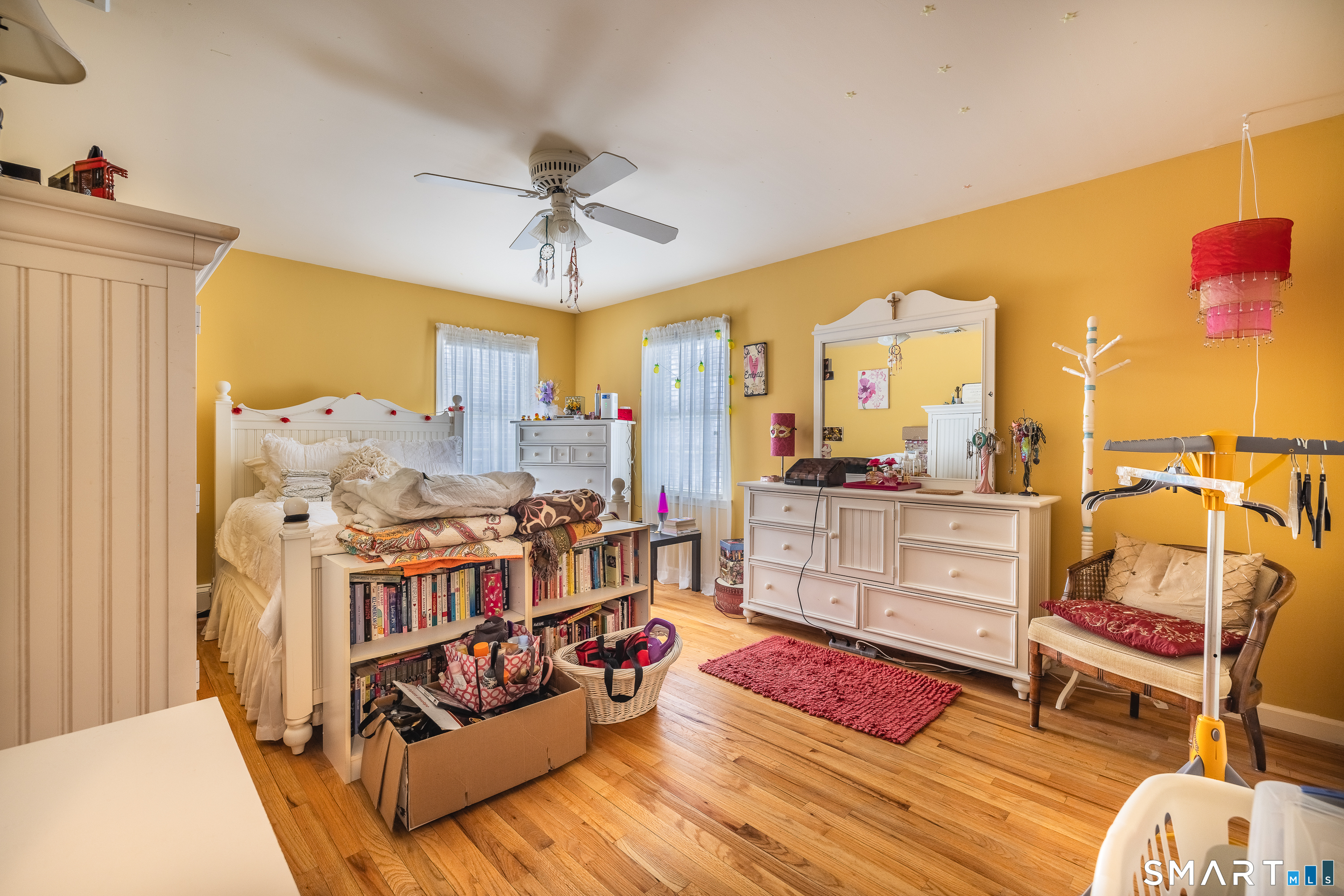 34 Bagburn Hill Road Monroe, CT 06468 - Photo 17 of 28 a living room with furniture and a chandelier