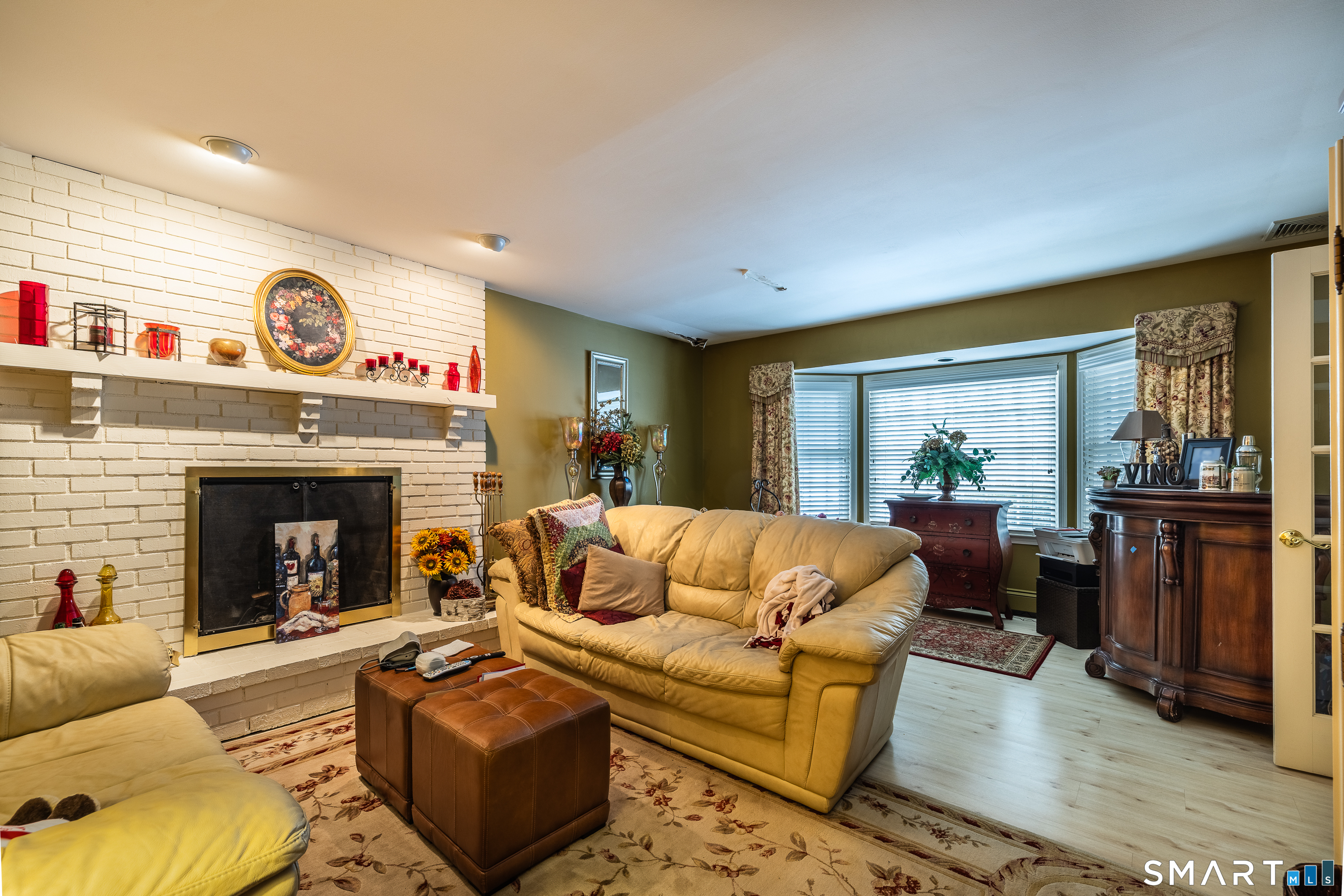 34 Bagburn Hill Road Monroe, CT 06468 - Photo 3 of 28 a living room with furniture and a fireplace