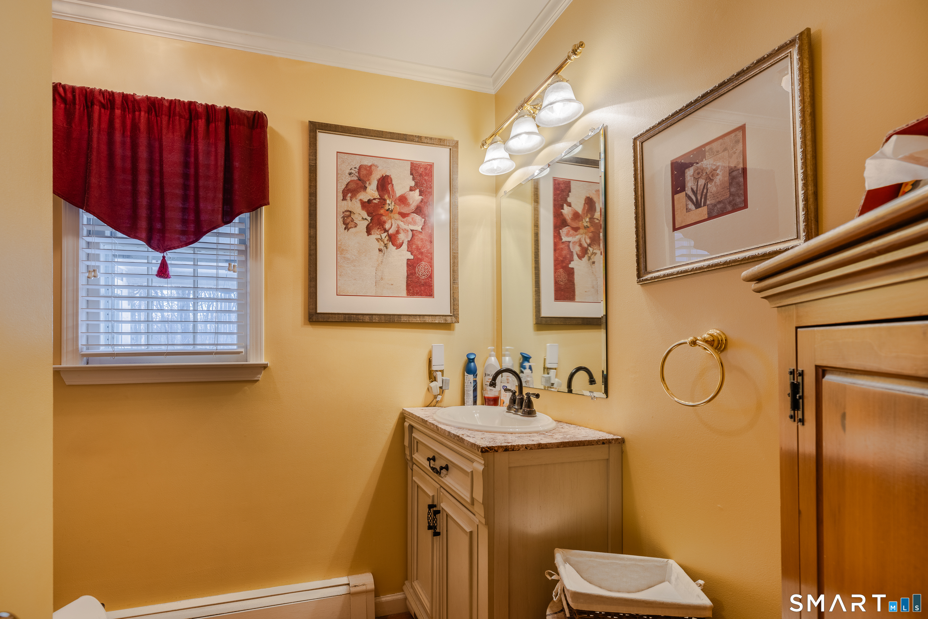 34 Bagburn Hill Road Monroe, CT 06468 - Photo 8 of 28 a bathroom with a toilet sink and mirror