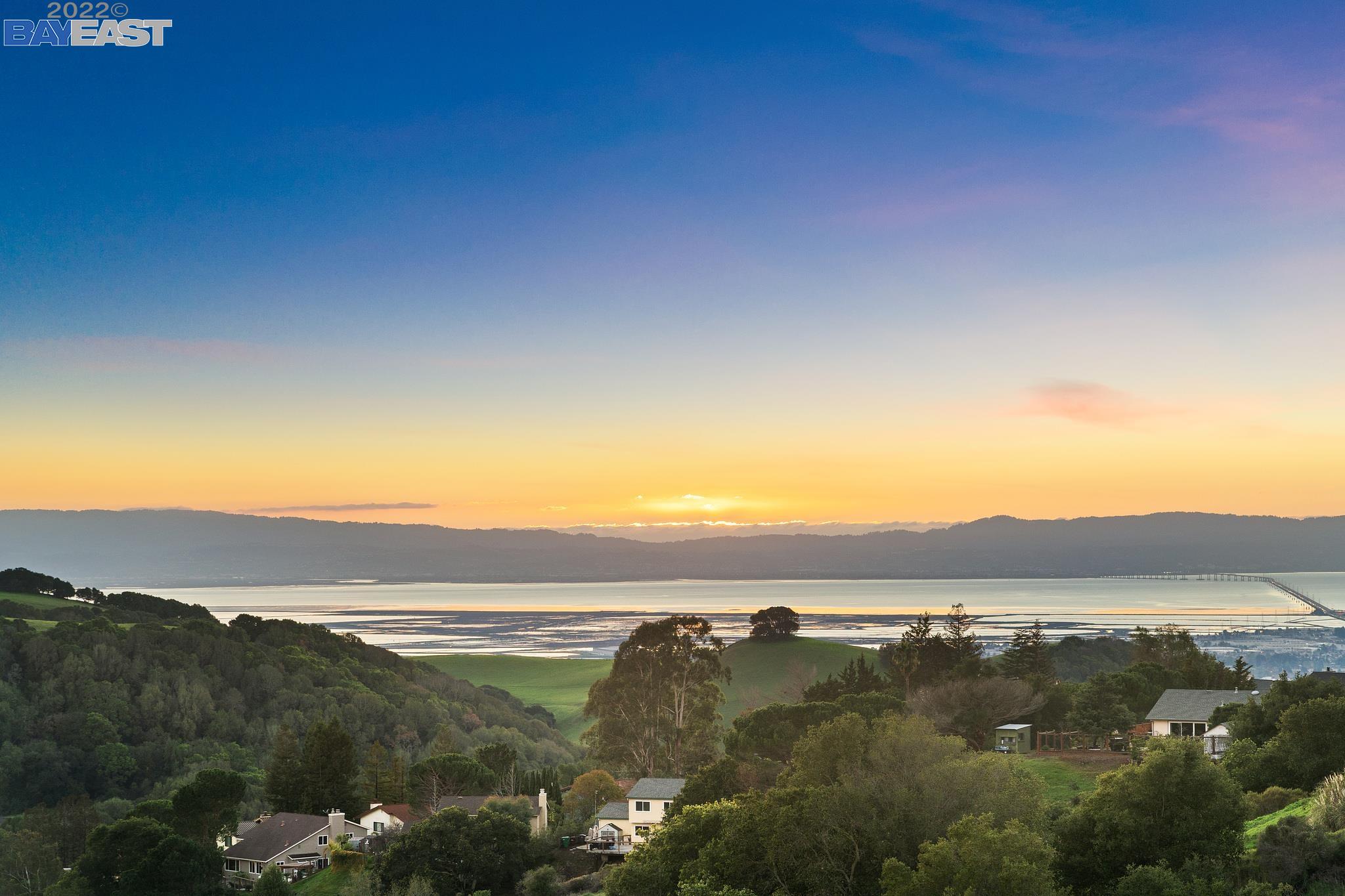a view of an ocean and sunset