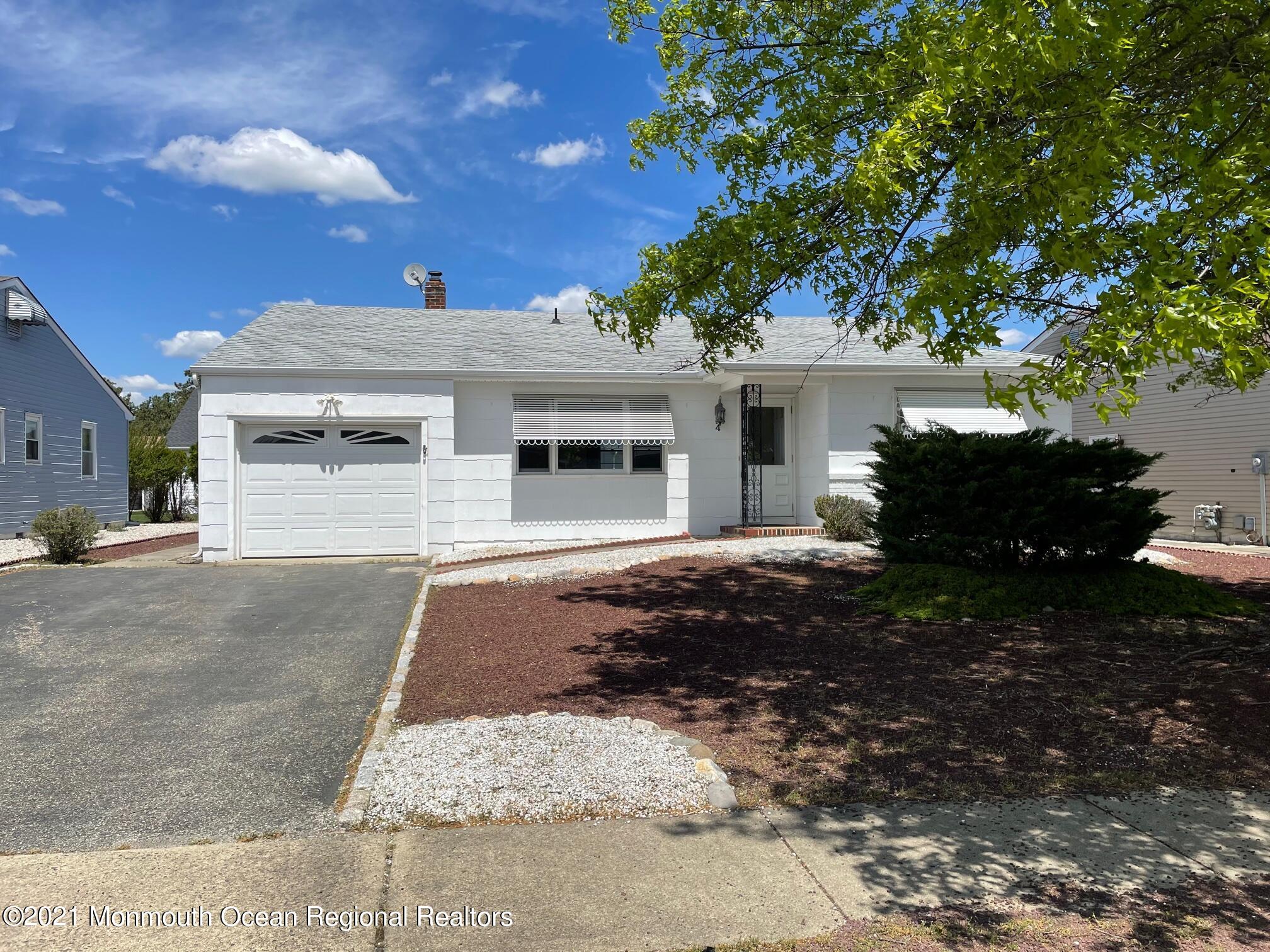 4 Sheridan Road Toms River, NJ 08757 - Photo 1 of 16 a front view of a house with a yard