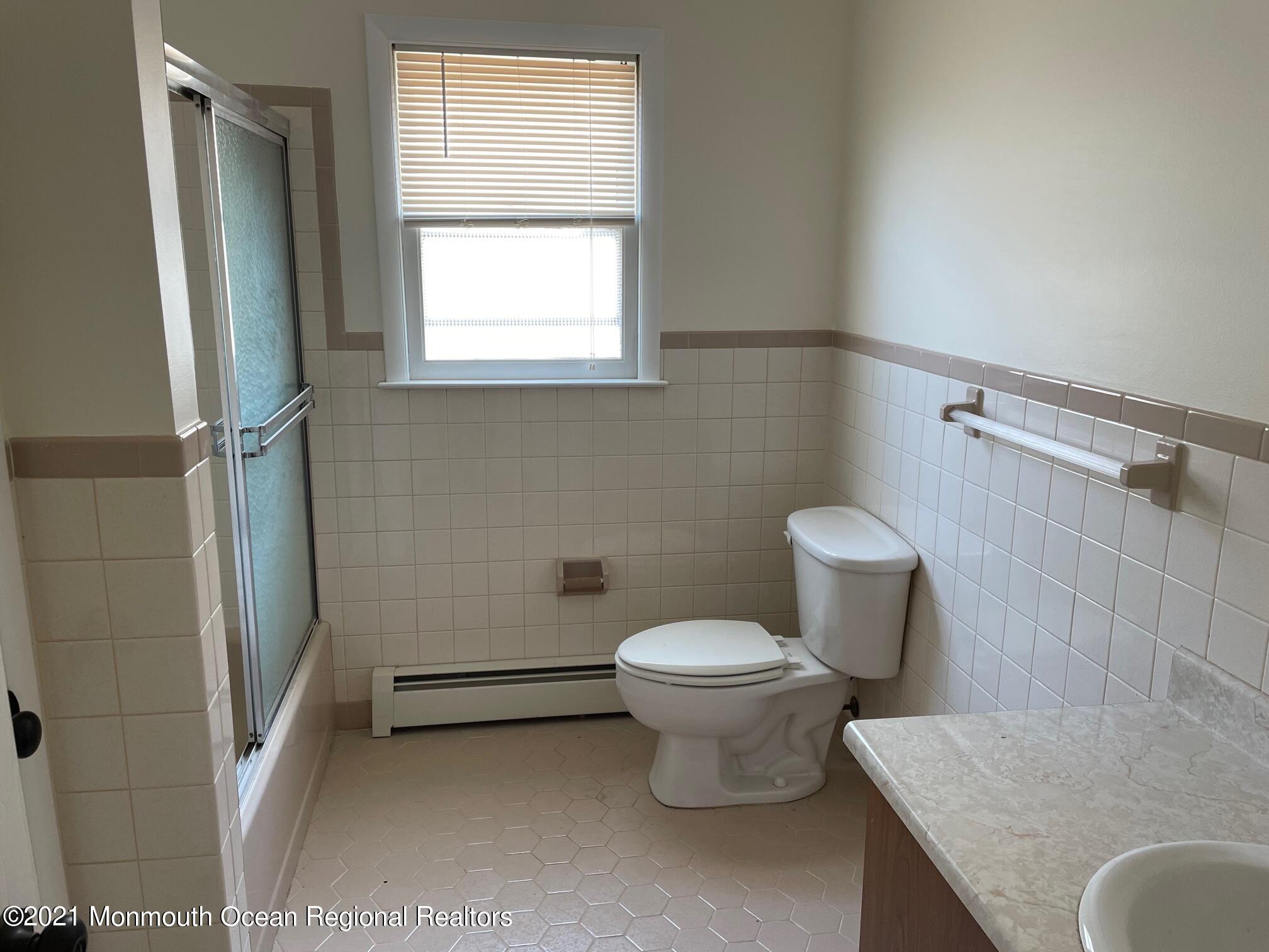 4 Sheridan Road Toms River, NJ 08757 - Photo 14 of 16 a bathroom with a granite countertop toilet and a sink