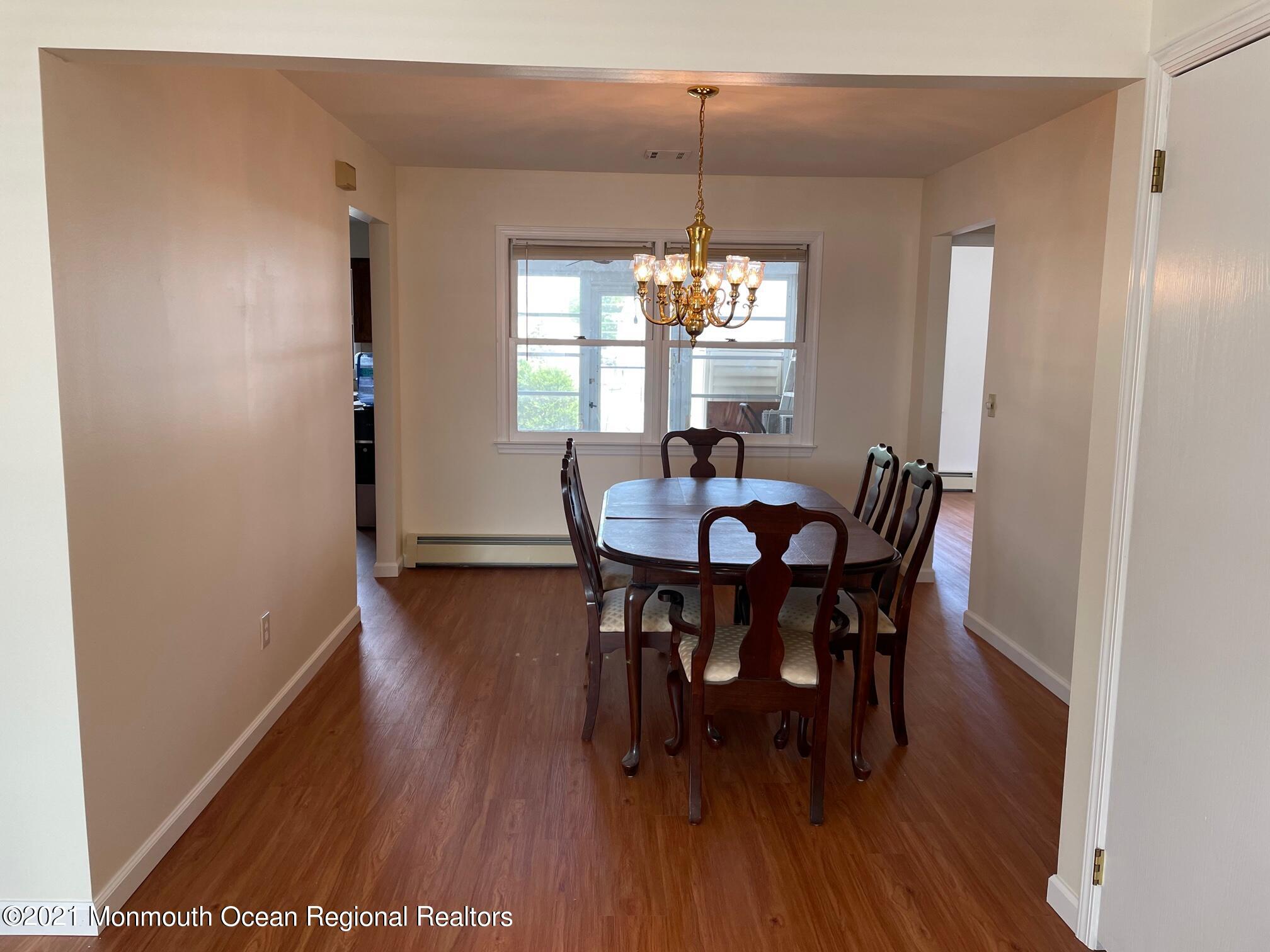 4 Sheridan Road Toms River, NJ 08757 - Photo 5 of 16 a view of a dining room with furniture and wooden floor
