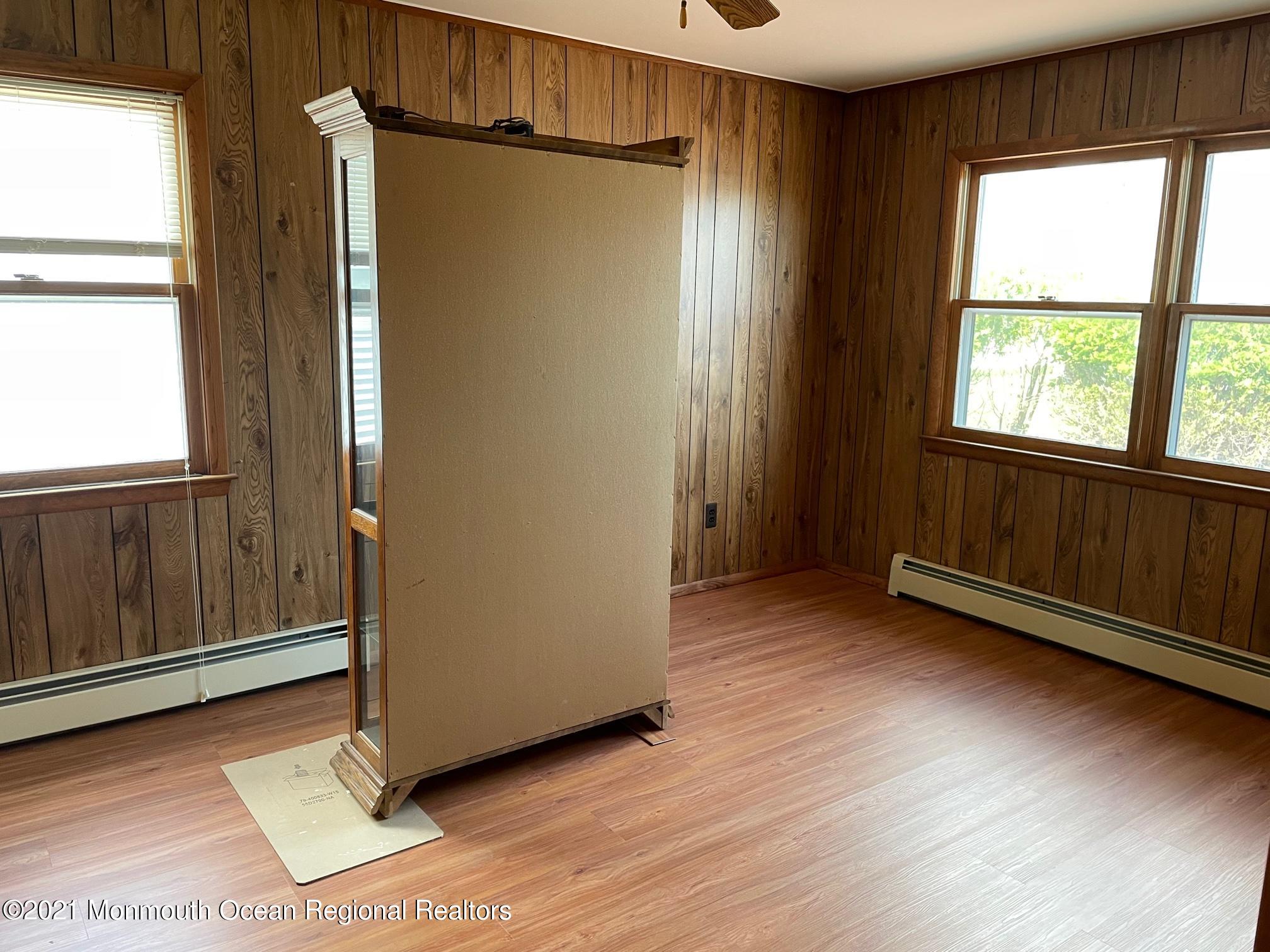 4 Sheridan Road Toms River, NJ 08757 - Photo 9 of 16 a view of an empty room with wooden floor and a window