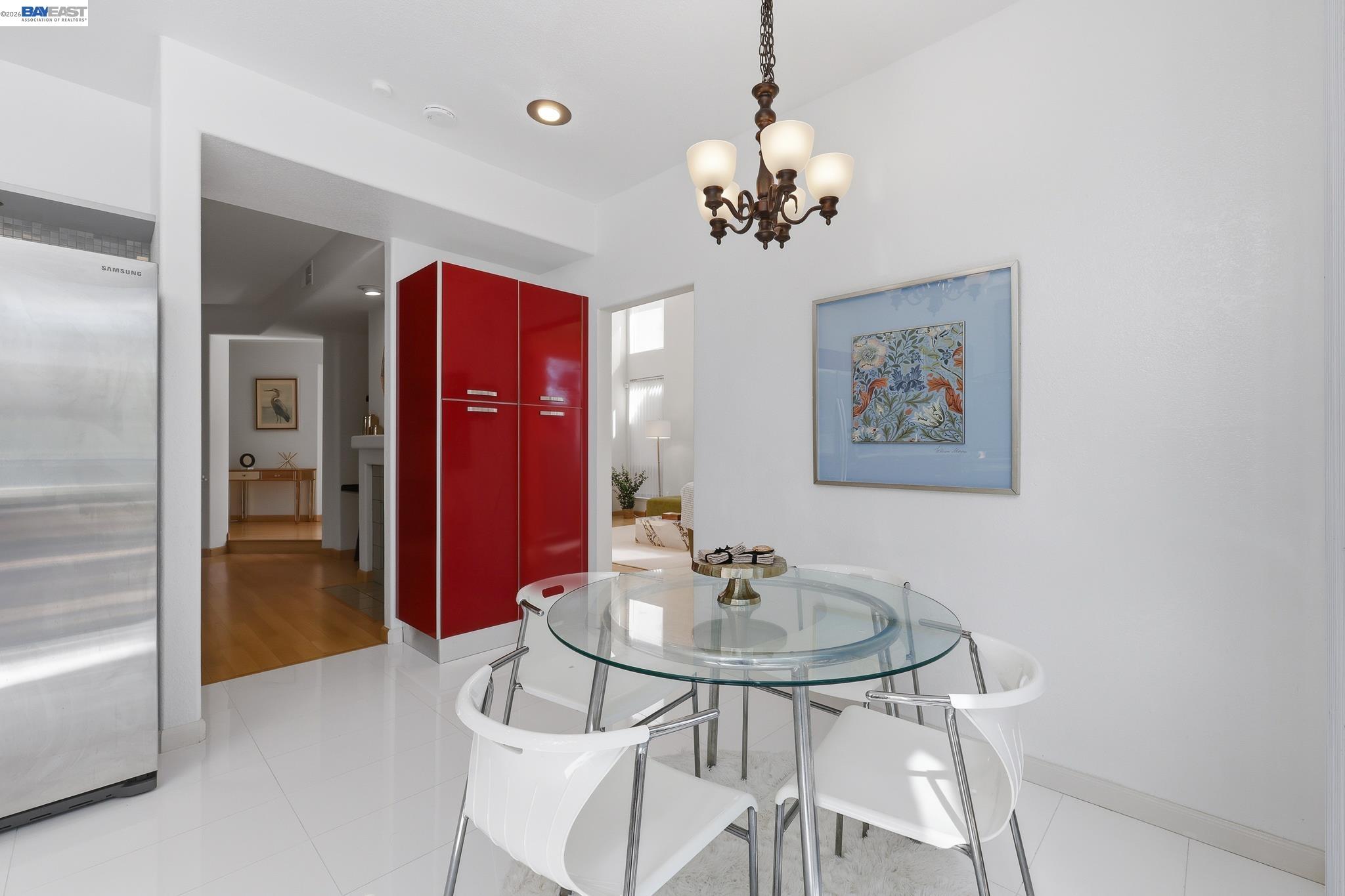 906 Vista Pointe Drive San Ramon, CA 94582 - Photo 20 of 60 a view of a dining room with furniture a chandelier and wooden floor