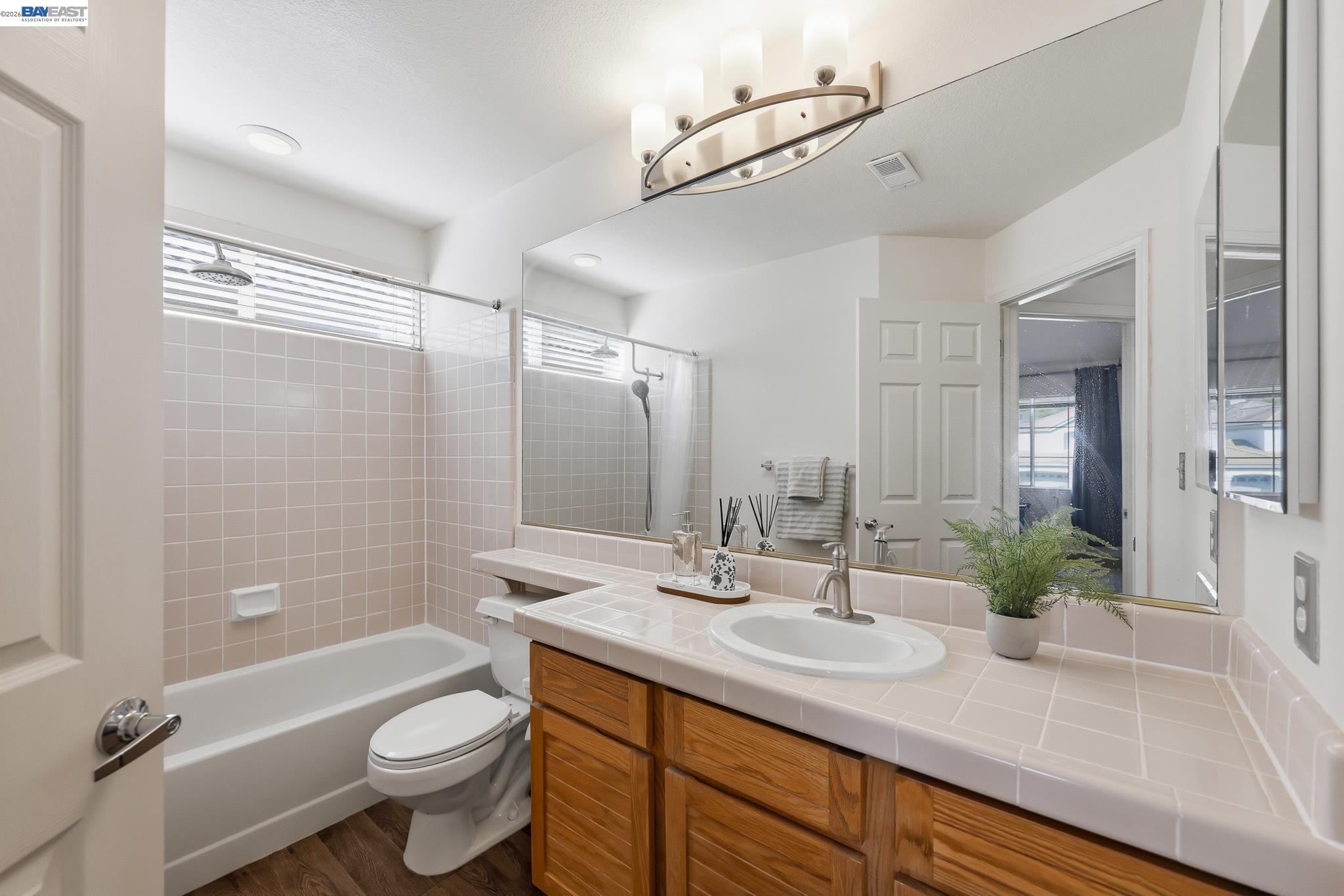 906 Vista Pointe Drive San Ramon, CA 94582 - Photo 37 of 60 a bathroom with a double vanity sink toilet mirror and bathtub