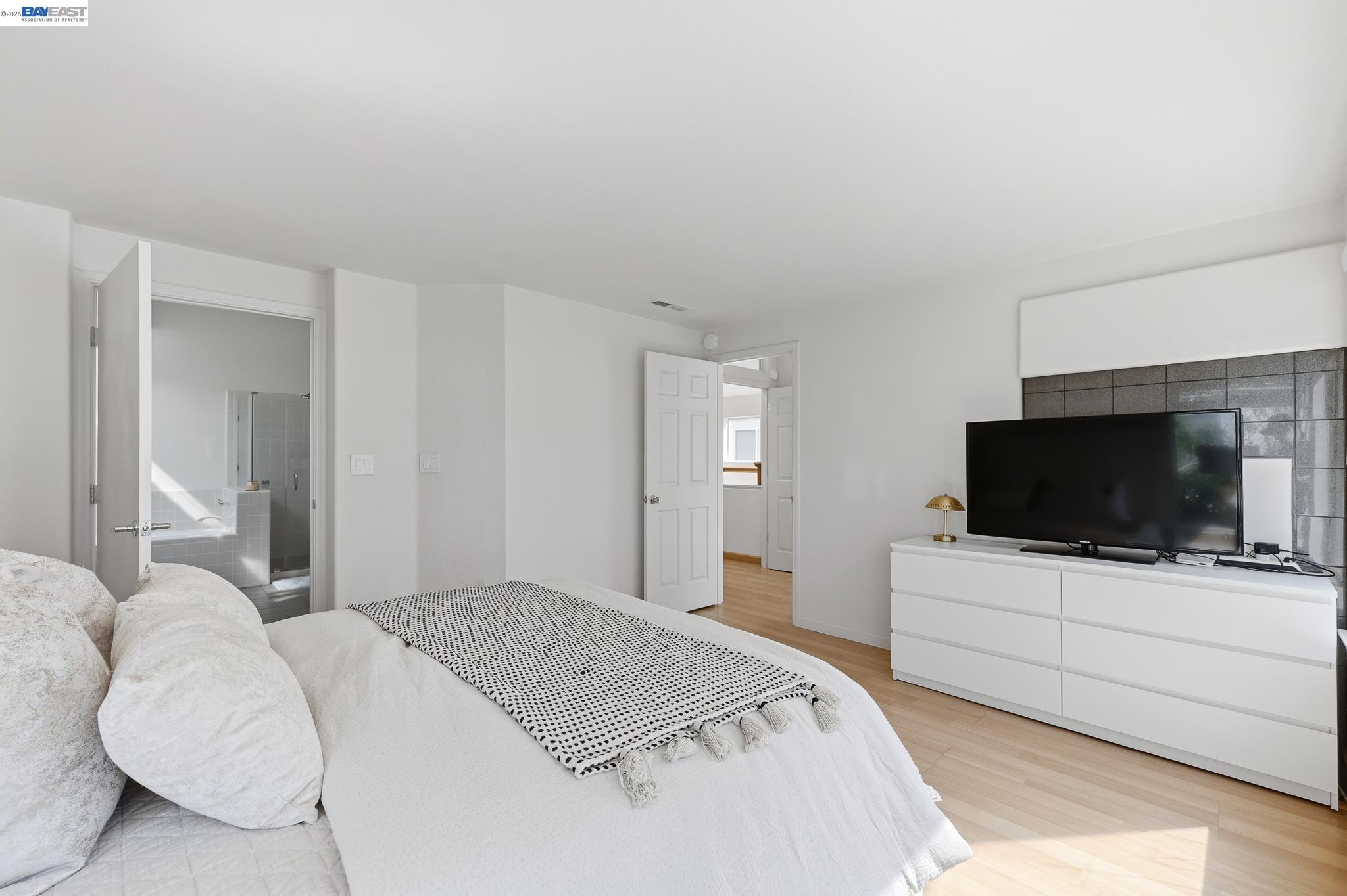 906 Vista Pointe Drive San Ramon, CA 94582 - Photo 42 of 60 a bedroom with a bed and a flat screen tv