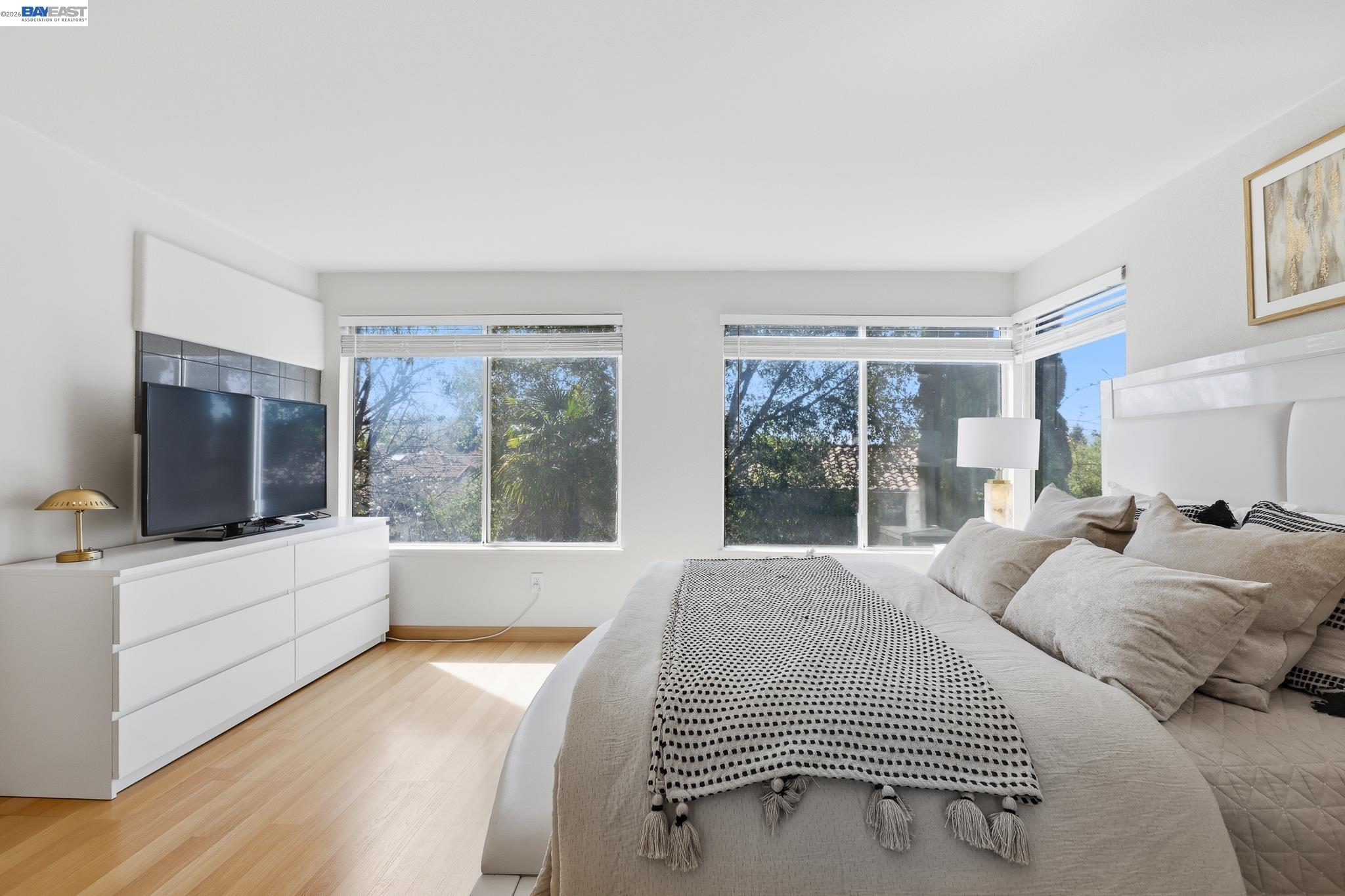 906 Vista Pointe Drive San Ramon, CA 94582 - Photo 43 of 60 a bedroom with a large bed and a flat screen tv