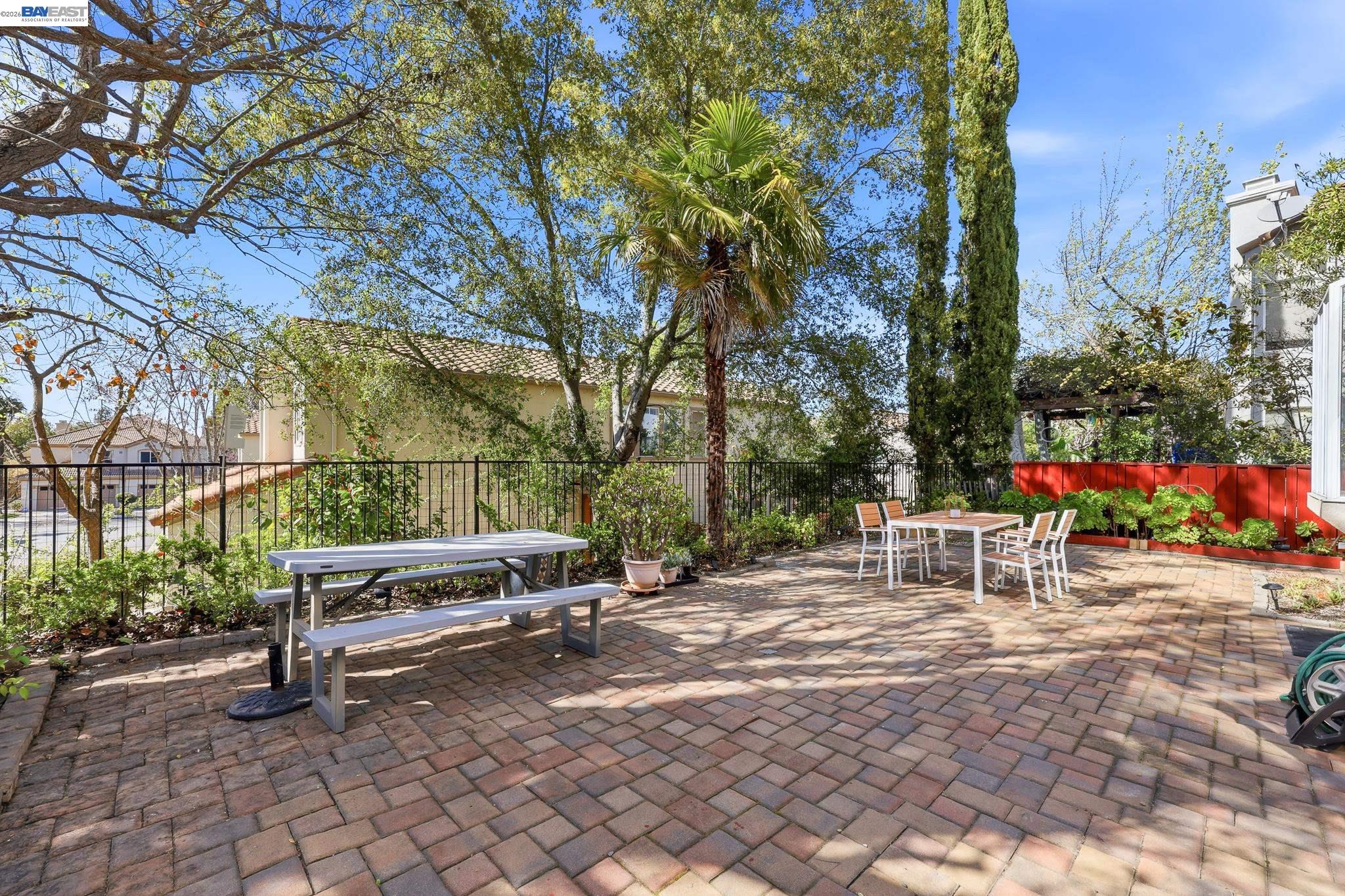 906 Vista Pointe Drive San Ramon, CA 94582 - Photo 52 of 60 a view of backyard with a table and chairs and potted plants