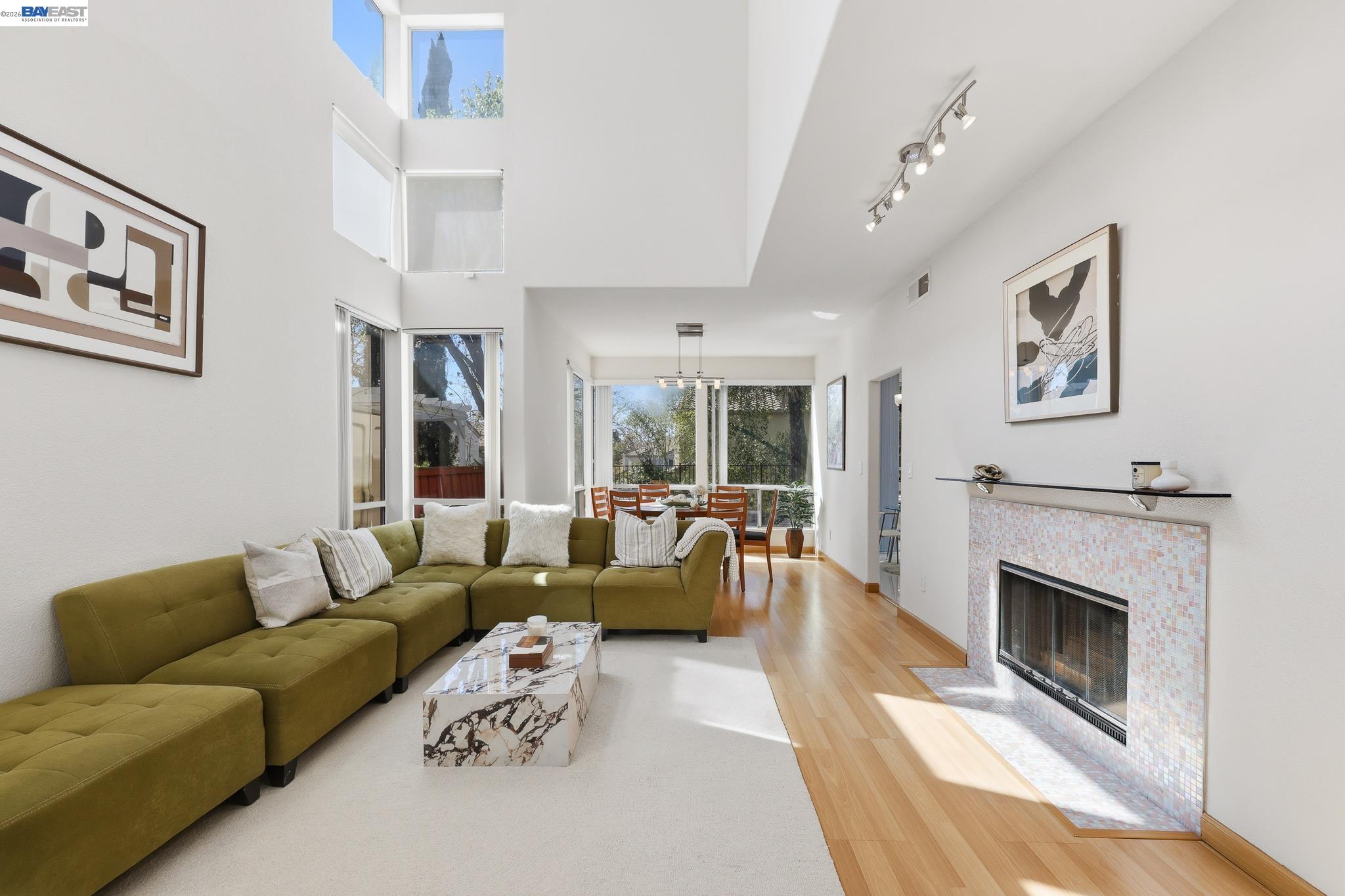 906 Vista Pointe Drive San Ramon, CA 94582 - Photo 6 of 60 a living room with furniture a large window and a fireplace