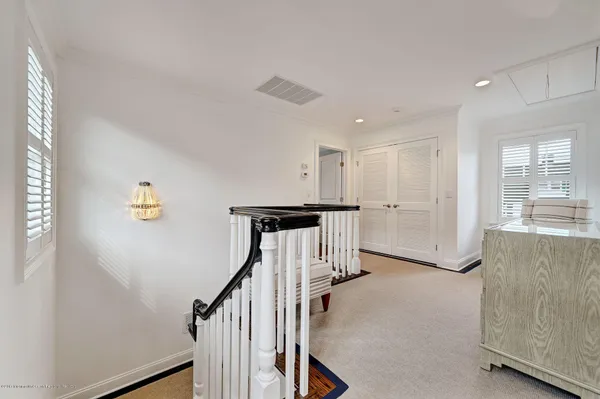 a view of a hallway with stairs