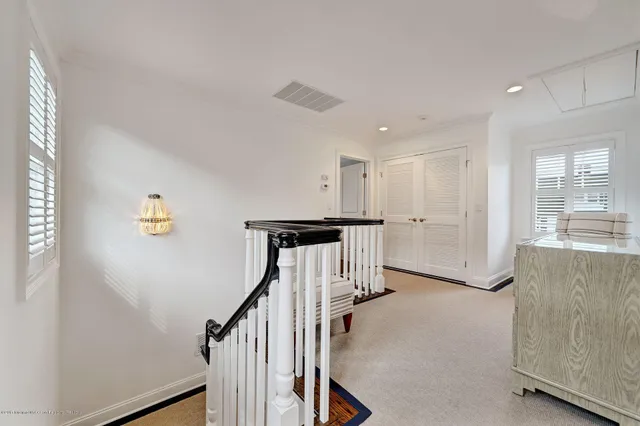 a view of a hallway with stairs