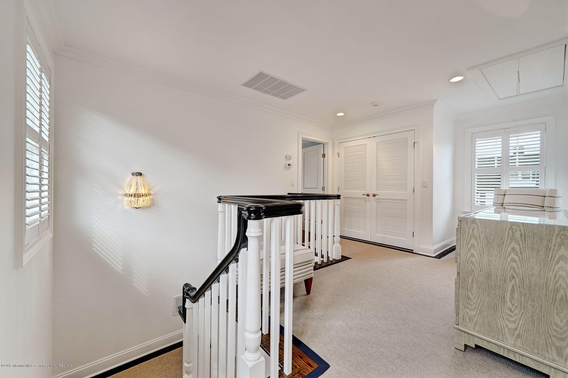 401 Monmouth Avenue Spring Lake, NJ 07762 - Photo 16 of 24 a view of a hallway with stairs