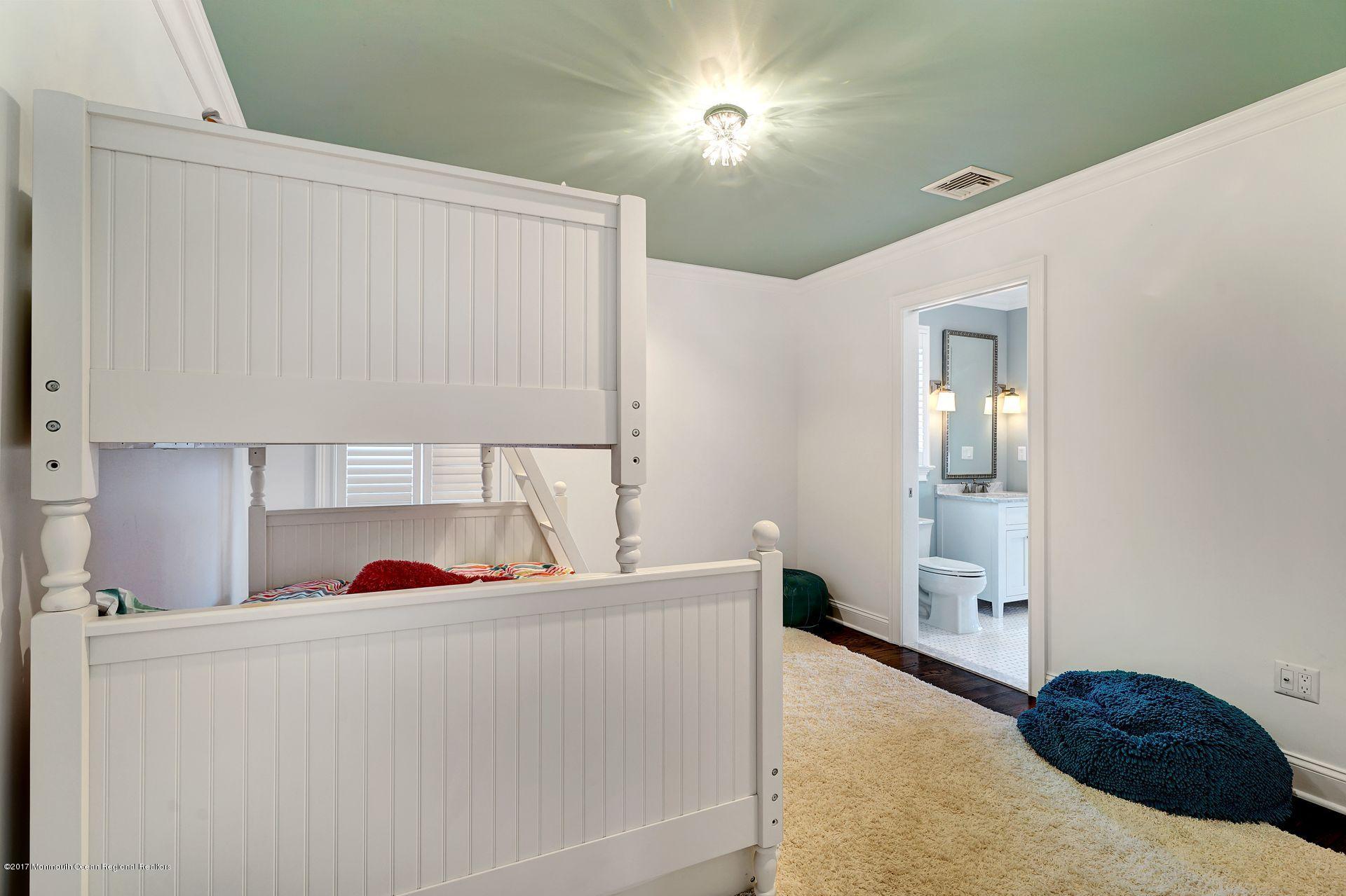 401 Monmouth Avenue Spring Lake, NJ 07762 - Photo 19 of 24 a living room with furniture and a window